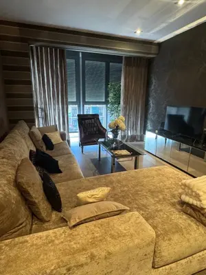 a living room with a couch and a television at Terra Boutique Cádiz in Cádiz