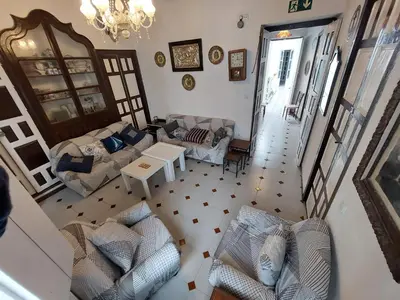 an aerial view of a living room with couches and a table at Casa Madre Gelart Patrimonio Gaditano del siglo XIX in San Fernando