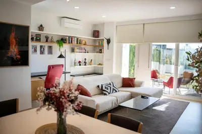 a living room with a couch and a table at Casa PLAYA FONTANILLA in Conil de la Frontera