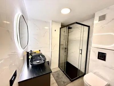 a bathroom with a walk in shower and a sink at alsur by Staycare in Jerez de la Frontera