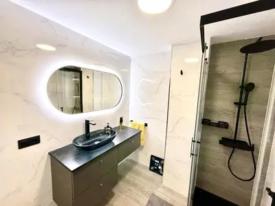 a bathroom with a sink and a mirror at alsur by Staycare in Jerez de la Frontera