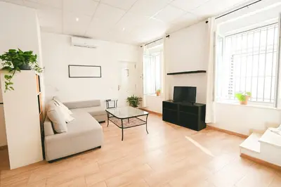 a living room with a couch and a table at Check-in autónomo Centro Histórico Todo a pie Ideal para parejas in Jerez de la Frontera