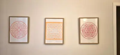 four framed paintings on a wall on a wall at Santa Catalina by Gades Gestión in Cádiz