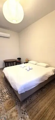 a bedroom with a large bed with towels on it at Santa Catalina by Gades Gestión in Cádiz
