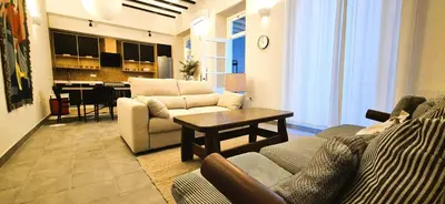 a living room with a couch and a table at Santa Catalina by Gades Gestión in Cádiz