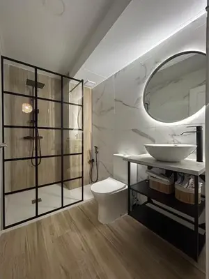 a bathroom with a sink and a toilet and a mirror at Apartamento Sol y Playa in Rota
