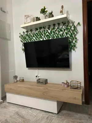 a flat screen tv hanging on a wall at Apartamento Sol y Playa in Rota
