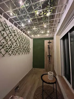 a room with a table and a ceiling with lights at Apartamento Sol y Playa in Rota