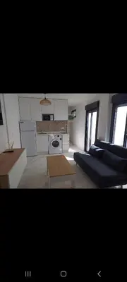 a living room with a couch and a table at Apartamento la Yedra in Jerez de la Frontera
