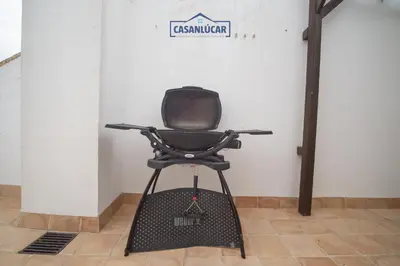 a black office chair sitting in a room at Casa 4 - Capuchinos in Sanlúcar de Barrameda