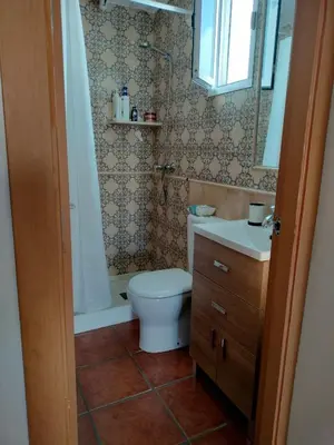 a bathroom with a toilet and a sink at Playa Las Redes in El Puerto de Santa María
