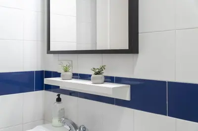 a bathroom with a sink with two plants on it at Apartoyou - Vistahermosa vistas in El Puerto de Santa María