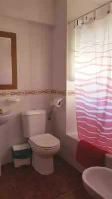 a bathroom with a toilet and a sink at Al- Andalus in Novo Sancti Petri