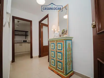 a colorful cabinet in a hallway with a kitchen at Carmen Viejo bajo in Sanlúcar de Barrameda