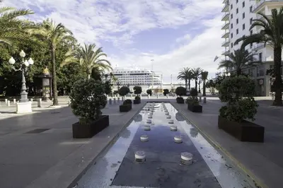 a fountain in a street with drinks on it at GuestReady - La Merced Cadiz in Cádiz