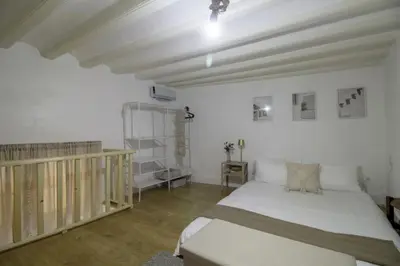 a bedroom with a large bed in a room at GuestReady - La Merced Cadiz in Cádiz
