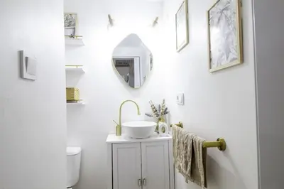 a bathroom with a sink and a mirror on the wall at GuestReady - La Merced Cadiz in Cádiz