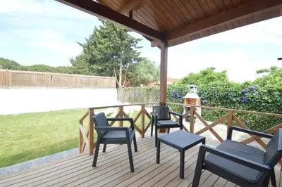 a group of chairs on a deck at Villa Farom in Cádiz