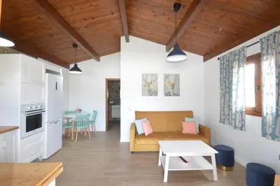 a living room with a couch and a table at Villa Farom in Cádiz