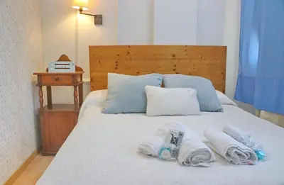 a bed with two towels on top of it at Apartamento con vistas Bahia Sur in San Fernando