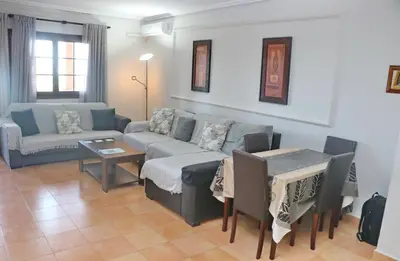 a living room with a couch and a table at Apartamento con vistas Bahia Sur in San Fernando