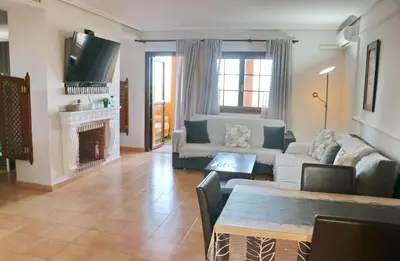 a living room with a couch and a fireplace at Apartamento con vistas Bahia Sur in San Fernando