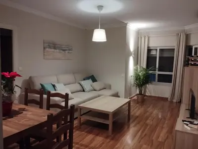 a living room with a couch and a table at Virgen de los Milagros in El Puerto de Santa María