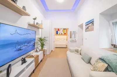 a living room with a large flat screen tv at Casa dSanz 