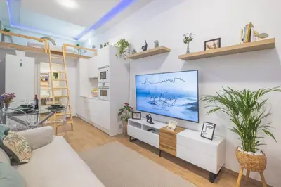 a living room with a large flat screen tv on a wall at Casa dSanz 
