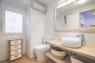 a bathroom with a sink and a toilet at Casa dSanz 
