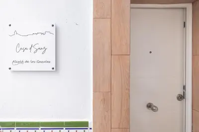 a sign on a wall next to a door at Casa dSanz 