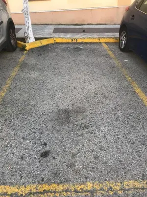 a parking lot with two cars parked in it at CasaLola in Sanlúcar de Barrameda