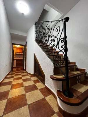 a staircase in a house with a checkered floor at CasaLola in Sanlúcar de Barrameda