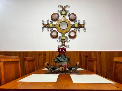 a wooden table with a mirror on a wall at CasaLola in Sanlúcar de Barrameda