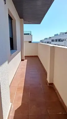 a balcony of a building with a tile floor at El Ático de la Angelita by RentCadiz in El Puerto de Santa María