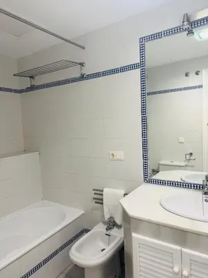 a bathroom with a sink and a tub and a toilet at La Casita Gaditana Centro in Cádiz
