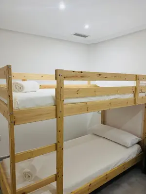a couple of bunk beds in a room at La Casita Gaditana Centro in Cádiz