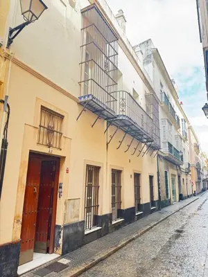 a row of buildings on a city street at La Casita Gaditana in Cádiz