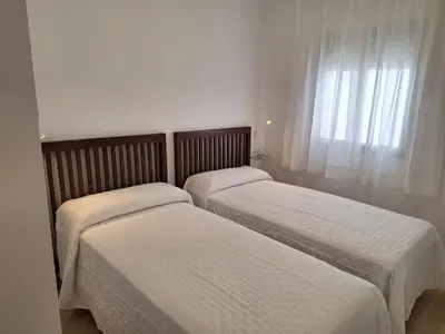two beds sitting next to each other in a bedroom at Plaza Doctor Barbadillo in Sanlúcar de Barrameda