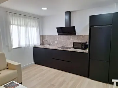 a kitchen with a sink and a counter top at Plaza Doctor Barbadillo in Sanlúcar de Barrameda