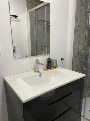 a bathroom with a white sink and a mirror at Casa Alzar2 in Jerez de la Frontera