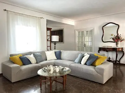 a living room with a couch and a table at Casa rural Pinar de la Plata in Arcos de la Frontera