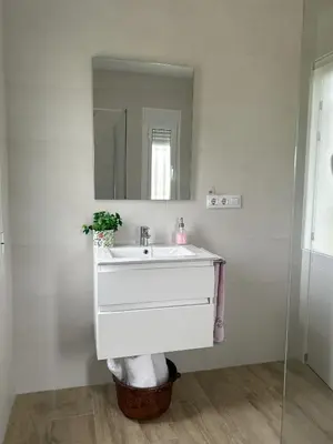 a bathroom with a white sink and a mirror at Casa rural Pinar de la Plata in Arcos de la Frontera