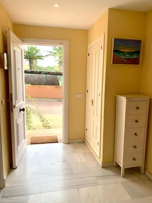 an empty room with a door open to a yard at Cerca del Mar in Novo Sancti Petri