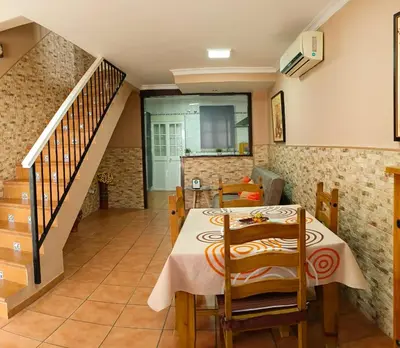 a kitchen and dining room with a table and chairs at La Playita de Arcos in Arcos de la Frontera