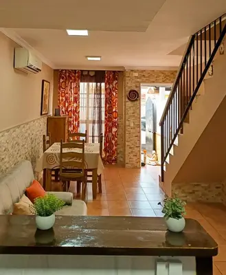 a living room with a couch and a table at La Playita de Arcos in Arcos de la Frontera
