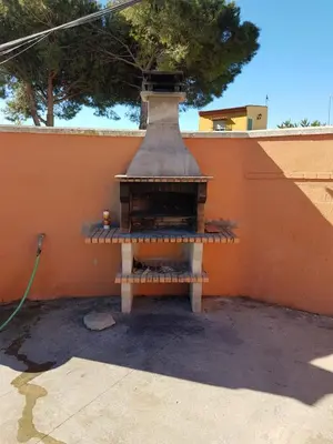 a bird house sitting on top of a wall at El Cotín Rural House in Novo Sancti Petri