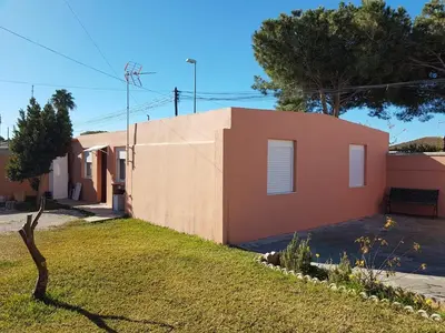 a house in a subdivision with a yard at El Cotín Rural House in Novo Sancti Petri