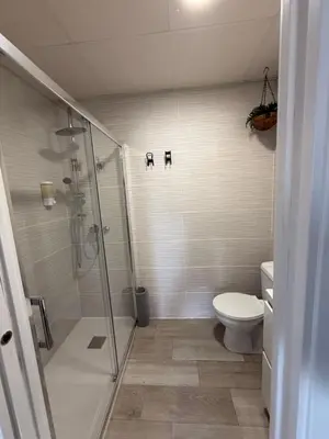 a bathroom with a shower and a toilet at Ático Bf Jerez in Jerez de la Frontera