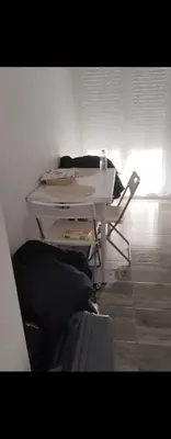 a white table and a chair in a room at Plateros 4 in Jerez de la Frontera